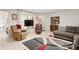 Cozy living room with comfy seating, a large TV, and area rug at 152 Audubon Ct, Winter Haven, FL 33884