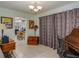 Home office with built-in desk and view into the kitchen area at 152 Audubon Ct, Winter Haven, FL 33884