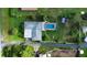 Aerial view showing house, pool, and large lot at 2423 State Road 557, Lake Alfred, FL 33850