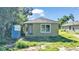 Newly built small single-Gathering home with a tan exterior at 1033 Lakewood Ct, Lakeland, FL 33801