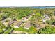 Aerial view of homes and properties near a lake at 1033 Lakewood Ct, Lakeland, FL 33801