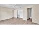 Bedroom with wood-look floors and an en-suite bathroom at 1033 Lakewood Ct, Lakeland, FL 33801