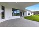 Covered patio with brick pavers and view of backyard at 1969 Grasslands Blvd, Lakeland, FL 33803
