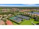 Community tennis courts with surrounding homes at 1969 Grasslands Blvd, Lakeland, FL 33803