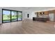 Open living room and kitchen with water view at 1969 Grasslands Blvd, Lakeland, FL 33803