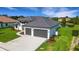 Two-car garage and waterfront property aerial view at 1969 Grasslands Blvd, Lakeland, FL 33803