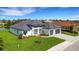 Modern house with two-car garage and manicured lawn at 1969 Grasslands Blvd, Lakeland, FL 33803