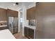 Modern kitchen with wine cooler and stainless steel appliances at 1969 Grasslands Blvd, Lakeland, FL 33803