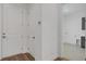 Bright hallway with laundry room access and two storage closets at 1969 Grasslands Blvd, Lakeland, FL 33803