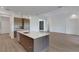 Modern kitchen with island and open floor plan at 1969 Grasslands Blvd, Lakeland, FL 33803