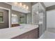 Modern bathroom boasts double vanity, glass shower, and marble flooring at 1969 Grasslands Blvd, Lakeland, FL 33803