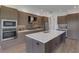 Modern kitchen with stainless steel appliances and an island at 1969 Grasslands Blvd, Lakeland, FL 33803