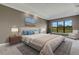 Main bedroom with king-size bed and sitting area, plus a large window at 1969 Grasslands Blvd, Lakeland, FL 33803