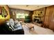 Living room with brick fireplace and window at 7520 Kathleen Rd, Lakeland, FL 33810