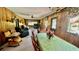 Combined living and dining area with wood paneling at 7520 Kathleen Rd, Lakeland, FL 33810