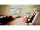 Bedroom with window, dresser, and armchair at 7520 Kathleen Rd, Lakeland, FL 33810
