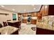 Large kitchen with granite countertops and wooden cabinetry at 7520 Kathleen Rd, Lakeland, FL 33810