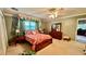Bright bedroom with carpet flooring and a wood dresser at 7520 Kathleen Rd, Lakeland, FL 33810
