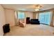 Comfortable bedroom with carpet flooring and a ceiling fan at 7520 Kathleen Rd, Lakeland, FL 33810