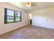 Bright bedroom with tile flooring, a window, and access to a bathroom at 2508 Providence Rd, Lakeland, FL 33805