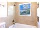 Bathroom with a bathtub and large window at 2508 Providence Rd, Lakeland, FL 33805