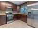 Updated kitchen with stainless steel appliances and granite countertops at 2508 Providence Rd, Lakeland, FL 33805