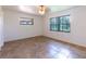 Spacious bedroom with tile floors and large windows at 2508 Providence Rd, Lakeland, FL 33805