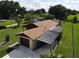 Single story home with attached garage and carport, surrounded by lush greenery at 2508 Providence Rd, Lakeland, FL 33805