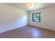 Spacious bedroom with tile flooring and a window offering natural light at 2508 Providence Rd, Lakeland, FL 33805