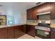 Modern kitchen with stainless steel appliances and granite countertops at 2508 Providence Rd, Lakeland, FL 33805