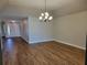 Bright dining room with hardwood floors and elegant chandelier at 727 Martinique Cir, Lakeland, FL 33803