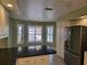 Kitchen boasts granite counters, breakfast nook, water view at 727 Martinique Cir, Lakeland, FL 33803