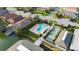 Community pool, shuffleboard, and lakefront view at 727 Martinique Cir, Lakeland, FL 33803