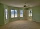 Spacious bedroom with water view and ceiling fan at 727 Martinique Cir, Lakeland, FL 33803