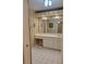Double vanity bathroom with large mirror and tiled floor at 727 Martinique Cir, Lakeland, FL 33803
