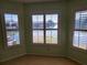Bedroom with bay window and water view at 727 Martinique Cir, Lakeland, FL 33803