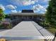 Community clubhouse with lake views and walkway at 727 Martinique Cir, Lakeland, FL 33803