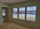 Bedroom with large window offering lake view at 727 Martinique Cir, Lakeland, FL 33803