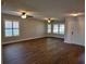 Spacious living room with wood-look floors and ceiling fans at 727 Martinique Cir, Lakeland, FL 33803