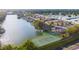 Aerial view of community with tennis courts and lake at 727 Martinique Cir, Lakeland, FL 33803