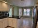 Kitchen with granite counters, breakfast nook, and water view at 727 Martinique Cir, Lakeland, FL 33803