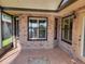 Enclosed porch with tiled floor and window at 727 Martinique Cir, Lakeland, FL 33803