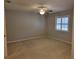 Spacious bedroom with carpeted floor and ceiling fan at 727 Martinique Cir, Lakeland, FL 33803