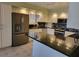Kitchen with granite countertops and stainless steel appliances at 727 Martinique Cir, Lakeland, FL 33803
