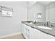Double vanity with modern fixtures and storage at 7770 Sandy Ridge Dr # 115, Reunion, FL 34747