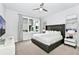 King-size bed, large window, and modern decor in a spacious bedroom at 7770 Sandy Ridge Dr # 115, Reunion, FL 34747