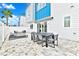Spacious backyard patio with seating area and modern design at 7770 Sandy Ridge Dr # 115, Reunion, FL 34747