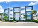 Modern three-story building with blue and white accents at 7770 Sandy Ridge Dr # 115, Reunion, FL 34747