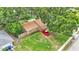 Aerial view of a ranch style home with a red car in the driveway at 1612 High Point Sw Ct, Winter Haven, FL 33880