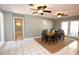 Spacious dining area with a wooden table and chairs, tile floors, and access to a hallway at 2646 Handley Blvd, Lakeland, FL 33803